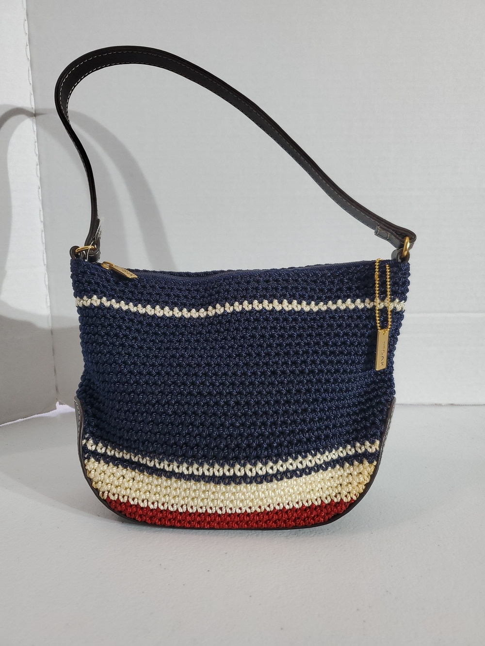 The Sak Navy Crochet Small Shoulder Bag with Cream and Red Stripes